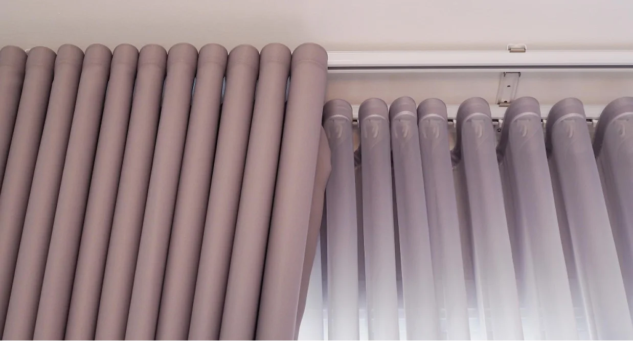 Close-up of S Fold curtain waves on a ceiling track